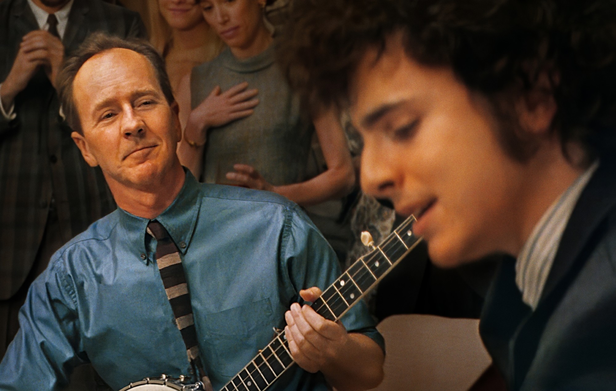 Timothée Chalamet as Bob Dylan and Edward Norton as Pete Seeger in 'A Complete Unknown'.