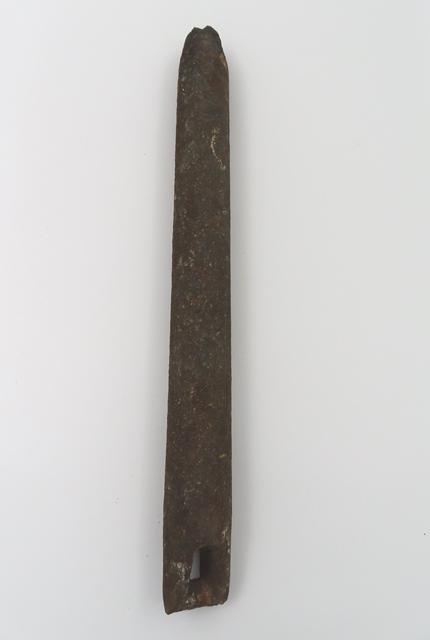 Long, rectangular metal counterweight with a narrow slot at one end.