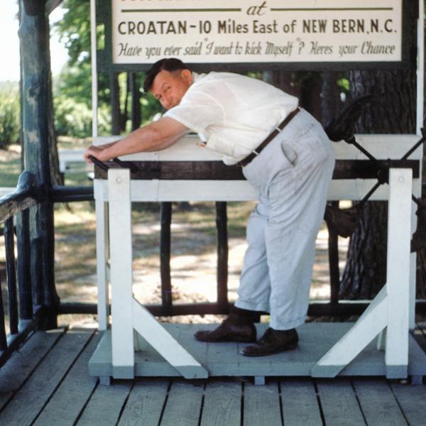Tom Haywood of Croatan demonstrates his kicking machine, which he built in 1937. 