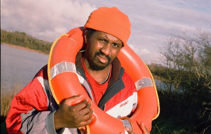 Hang Linton with a lifebuoy around their neck, photo by press