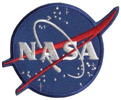NASA logo patch with a blue background, white lettering, a red swoosh, and orbital elements.]