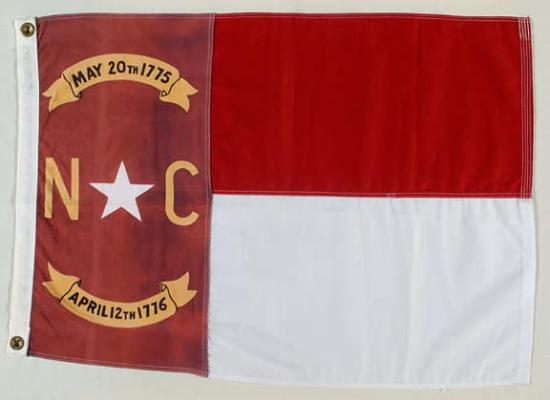 Flag of North Carolina featuring a red field with two dates written in black on gold ribbons and the letters N C with a white star in the center.
