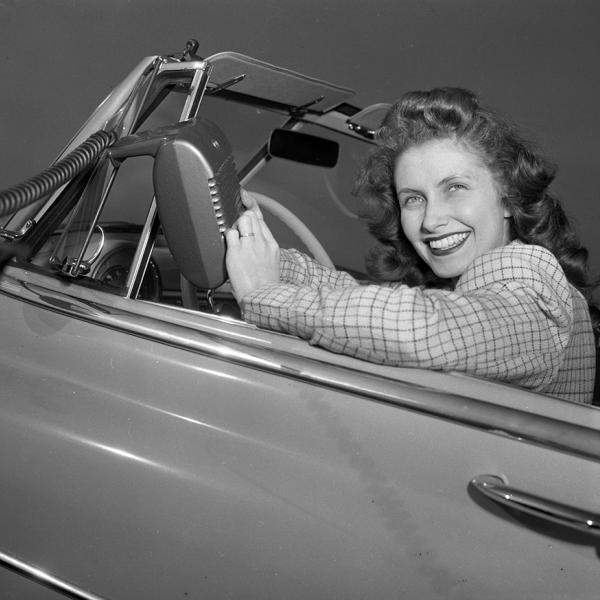 Woman in 1950's car