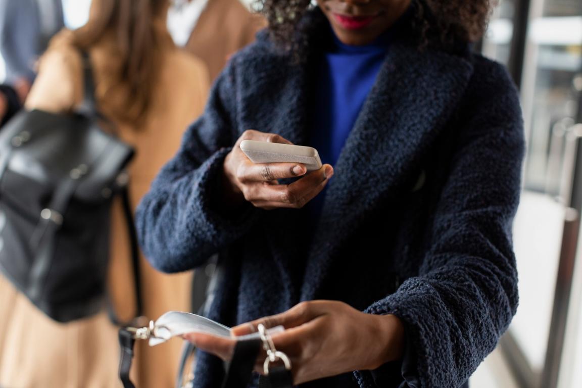 African American scanning her badge